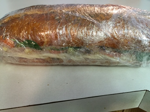 6.     Press down the sandwich firmly and roll it in plastic wrap tightly. I double wrap it to minimize any air or leakage.