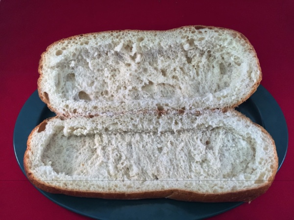 1.	Slice open the bread and discard the center, leaving aproximately ¾ inch to 1 inch of bread all around.  I prefer to toast the hollowed out bread, added flavor and allows it to standup to the moisure better once completed.
