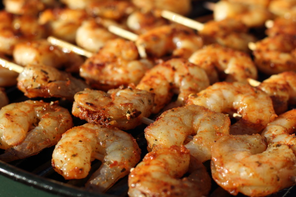 Right before you put the shrimp on the grill, brush each skewer with a generous amount of avocado or olive oil, to prevent sticking. 