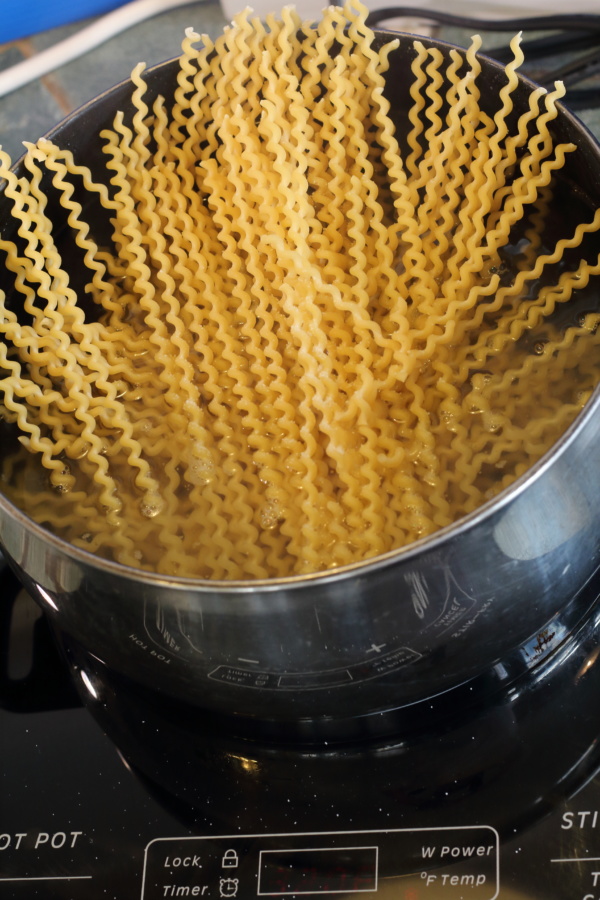 Bring the water to a hard boil and heavily salt the water to cook the pasta.  Depending on type of pasta the cooking time will vary,